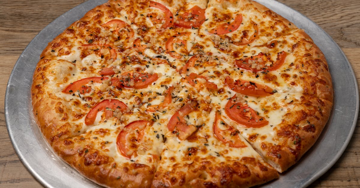 savor a freshly baked margherita pizza topped with ripe tomatoes and melted mozzarella cheese 1