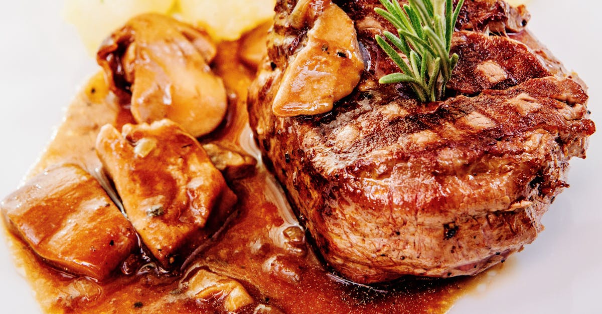 savory steak with mushroom sauce and potatoes garnished with rosemary 4
