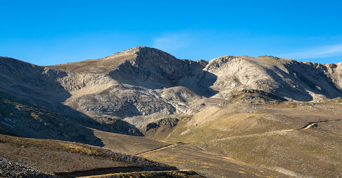 scenic mountain range in bursa turkey with clear blue skies and sunlight casting shadows