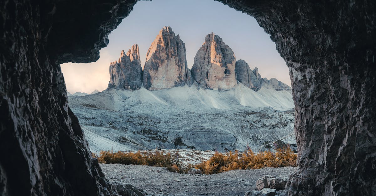 scenic view of the iconic tre cime mountains framed by a cave in the italian dolomites 1
