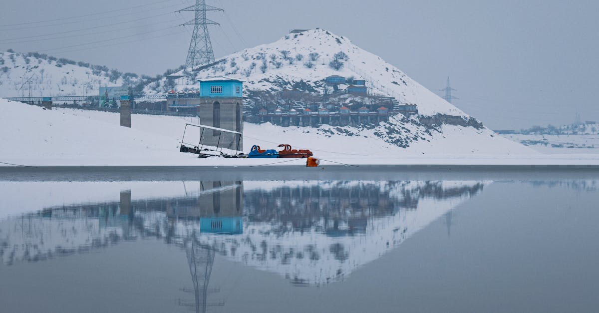 scenic winter view of qargha reservoir reflecting snowy hills in kabul afghanistan