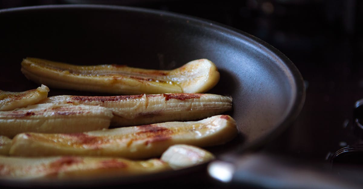 sliced bananas being fried in a non stick pan capturing a delicious culinary moment 1