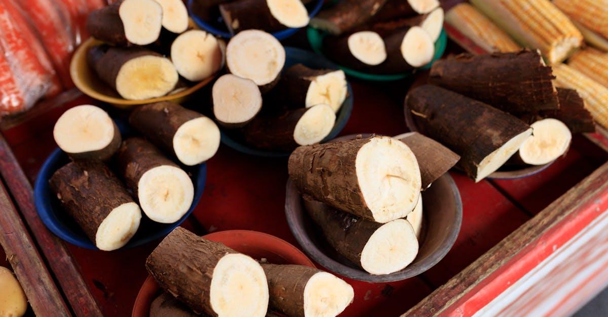 sliced cassava on display at a market stall offering fresh produce for sale