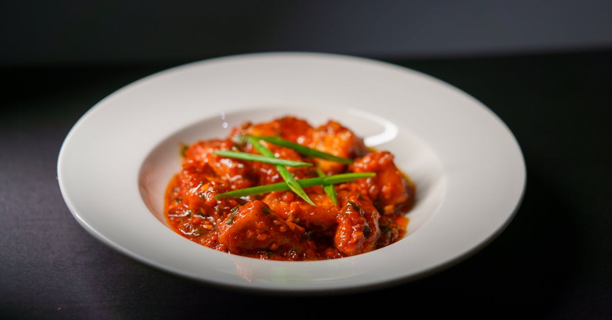 spicy indian paneer tikka served in a rich tomato based gravy garnished with green scallions 1