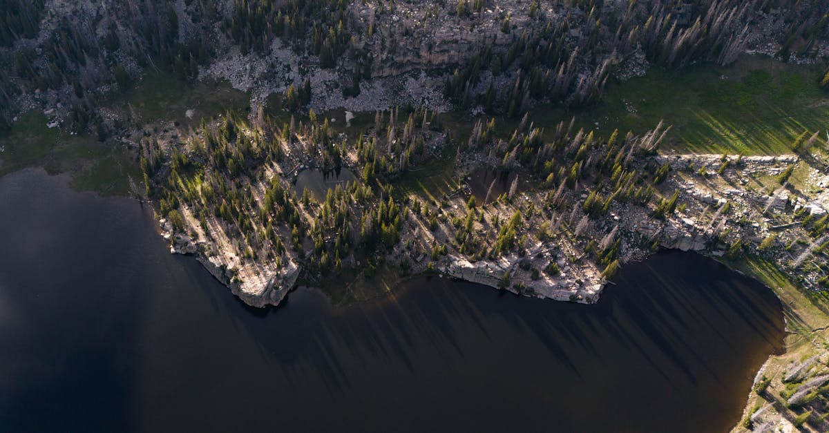 stunning aerial photography showcasing the lake shore and forested landscape in kamas utah