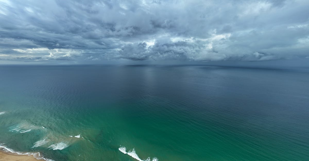 stunning aerial view of the coastline under dramatic clouds in belmont australia