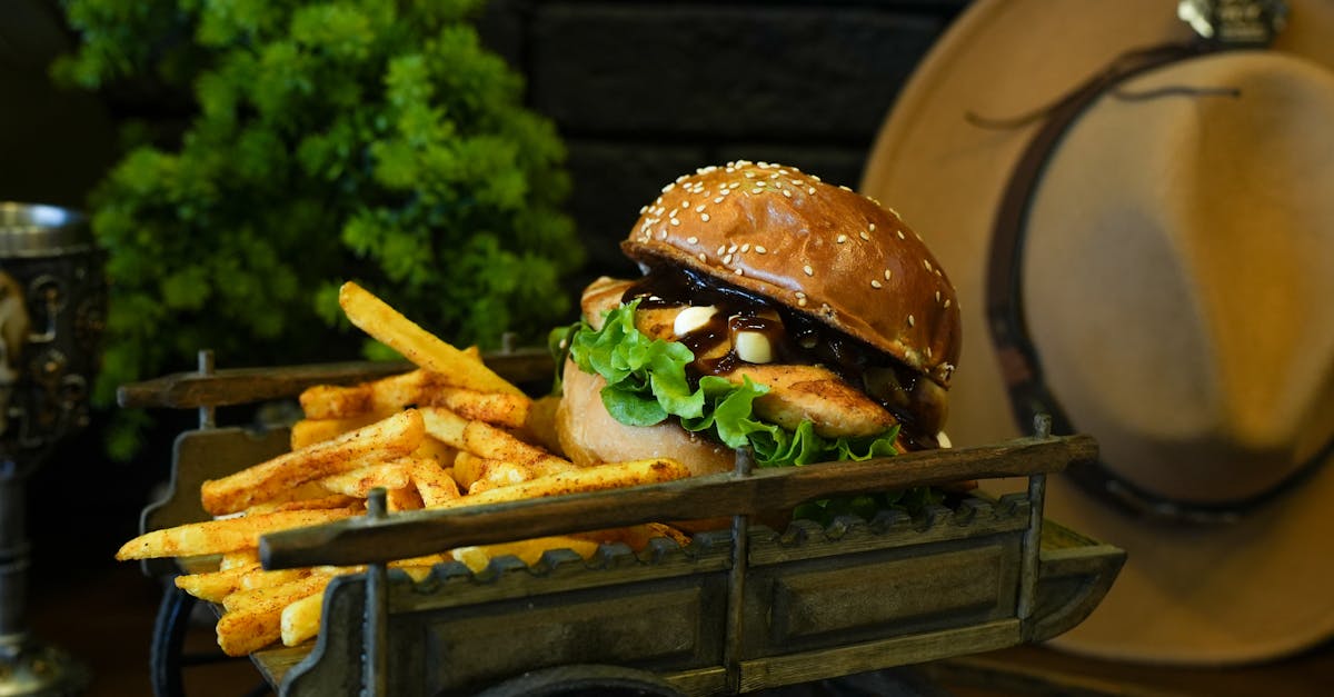 tasty chicken burger with lettuce and fries served on a rustic wagon perfect for gourmet or fast fo