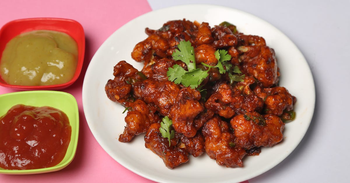 tasty crispy cauliflower dish with two savory sauces on a vibrant background