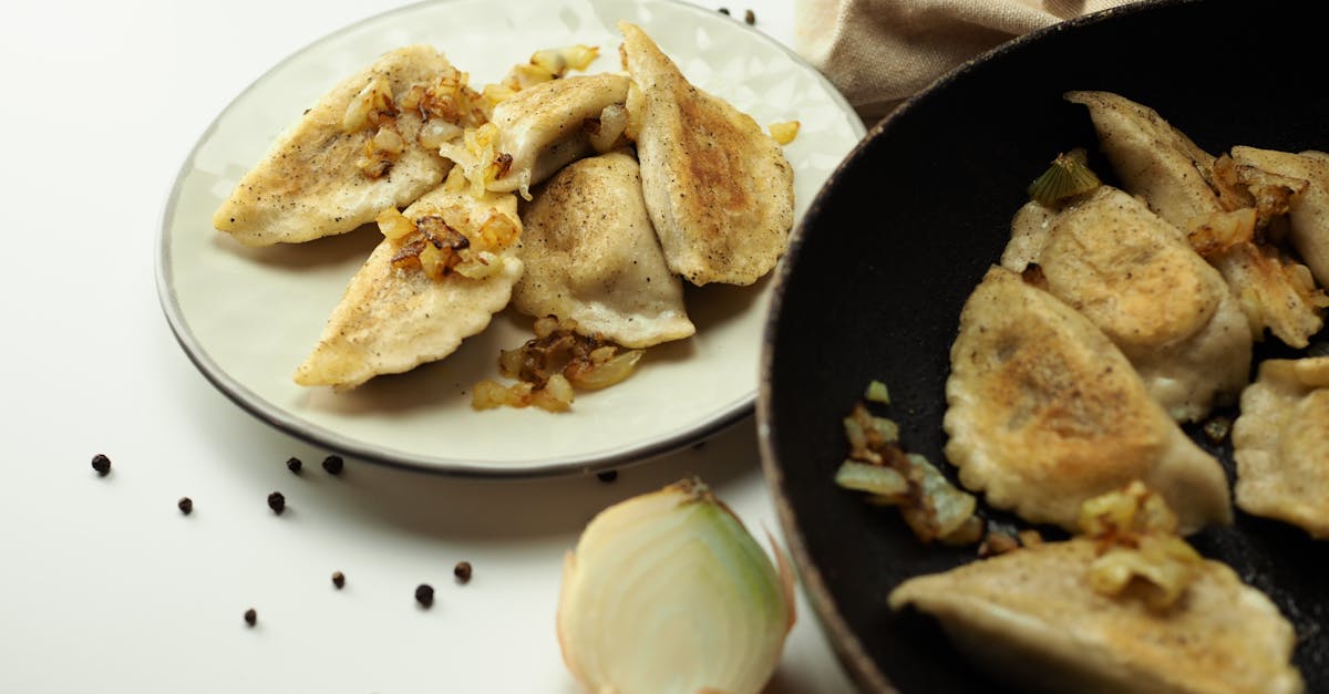 Home tasty fried dumplings served with caramelized onions perfect for a savory asian inspired meal