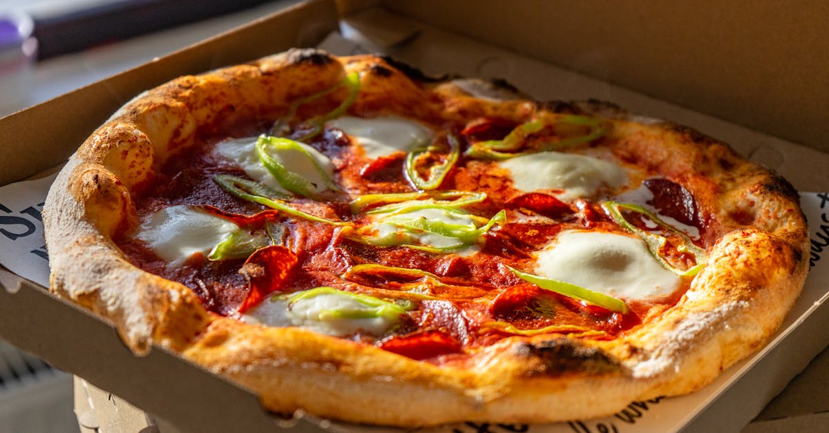tasty neapolitan pizza with fresh ingredients in a cardboard box perfect for takeout