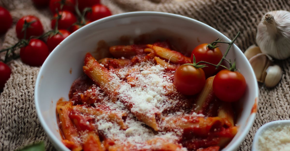 tasty penne pasta in a rich tomato sauce topped with parmesan cheese