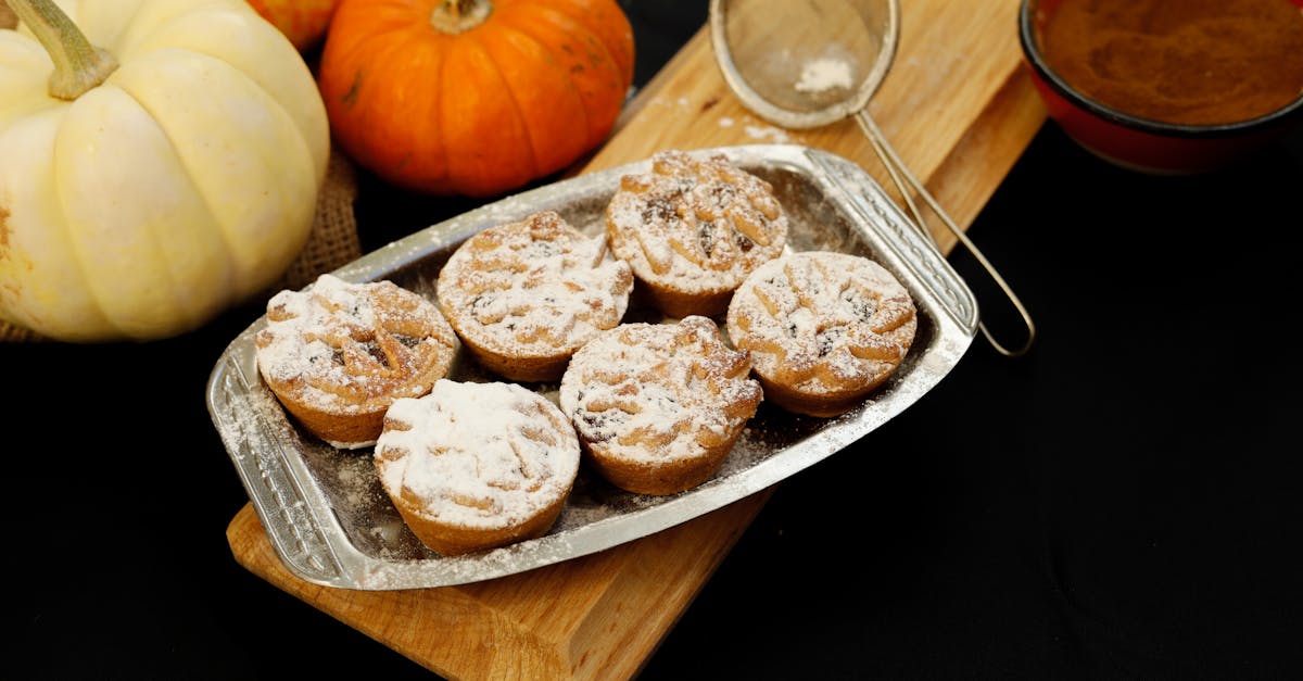 tasty pumpkin spice muffins dusted with sugar surrounded by pumpkins and spices perfect for autumn 4