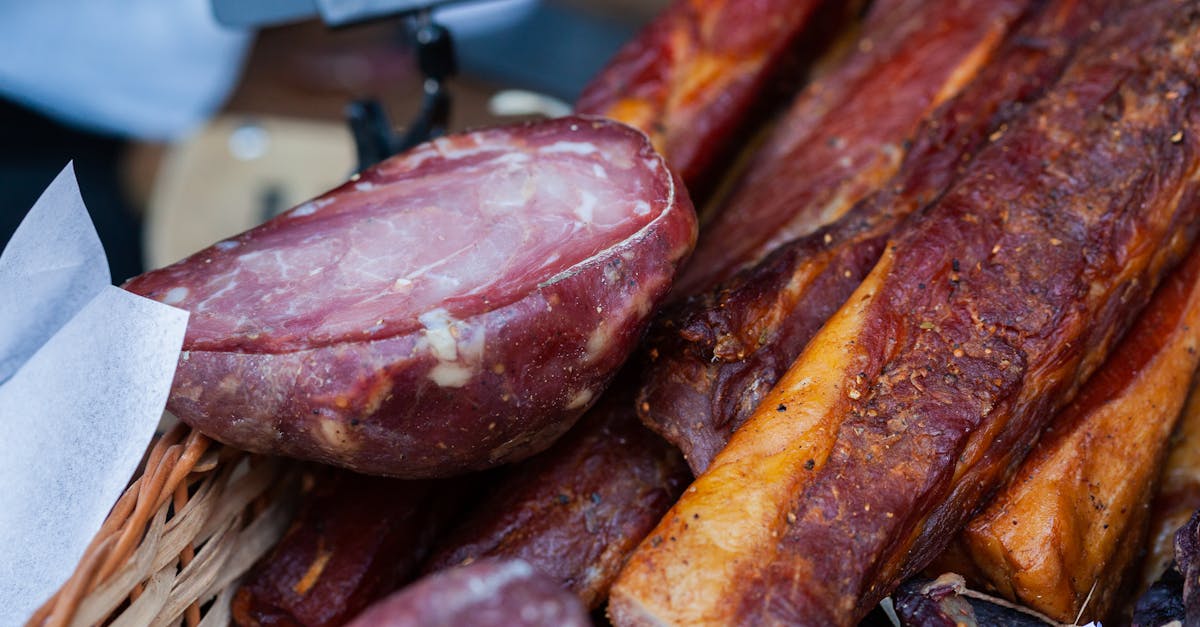 tempting close up of assorted smoked meats in a market basket showcasing rich textures and flavors 1