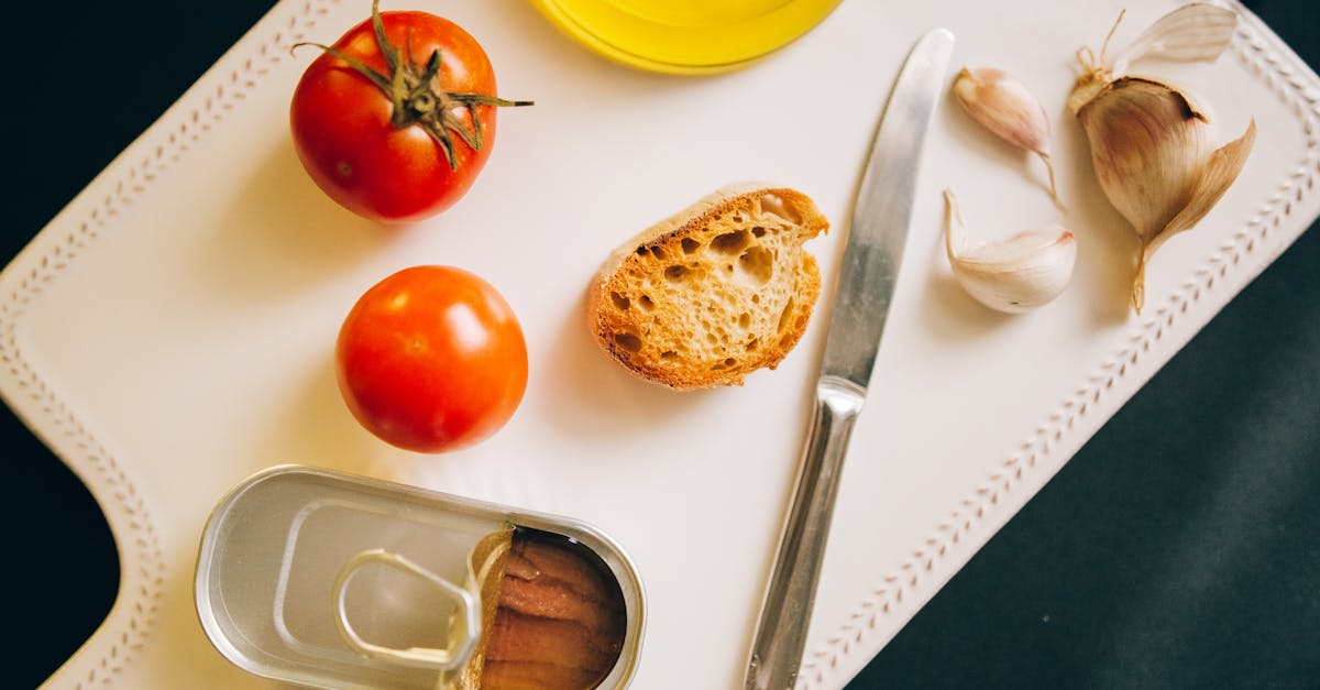 tomatoes bread and sardines arranged for catalan toast preparation
