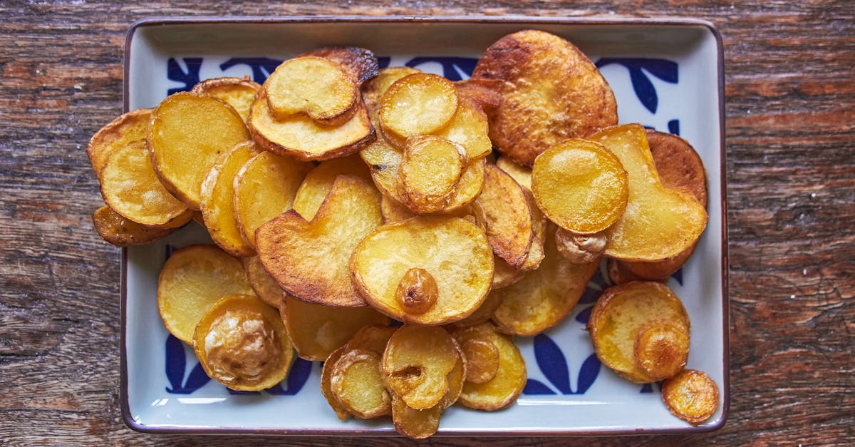 top view of crispy homemade baked potato slices on a rustic plate perfect for a delicious snack 1