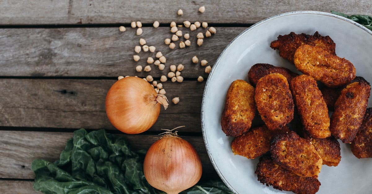 top view of crispy vegetable fritters with onions and chickpeas on a wooden table