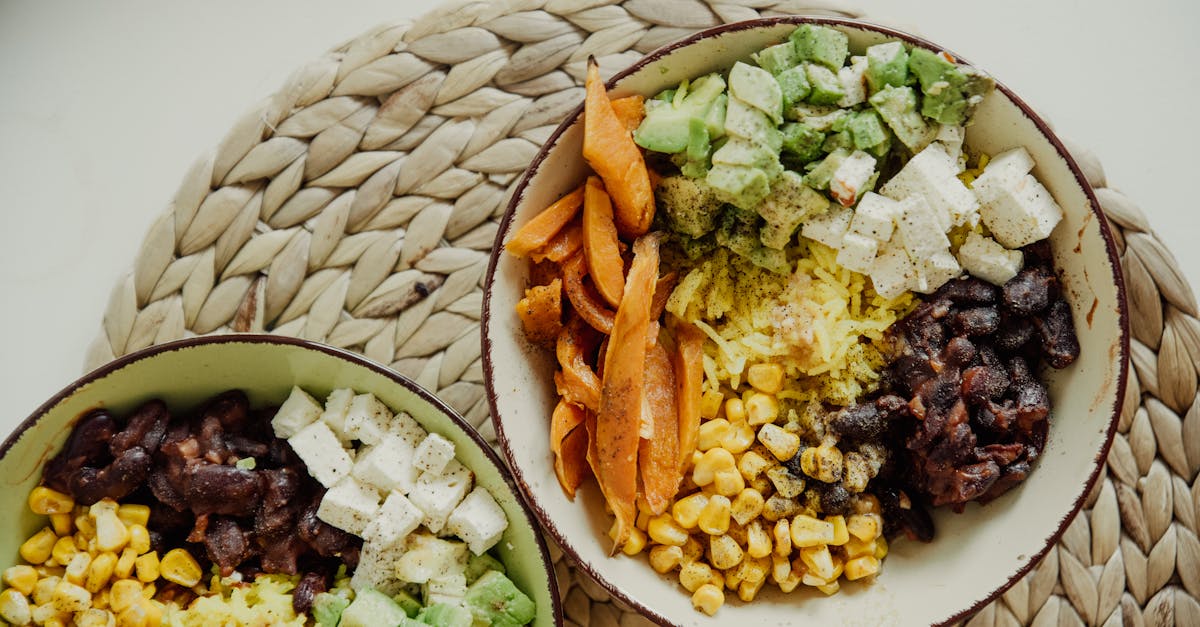 top view of vegetarian bowls with avocado corn beans and cheese for a delicious meal