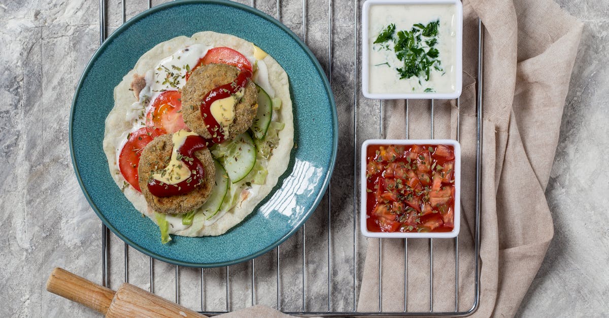 top view of vegetarian falafel on a blue plate with dips perfect for food photography