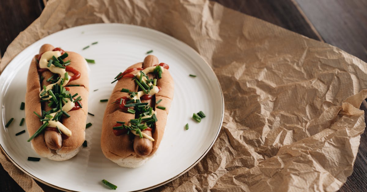 two hot dogs with mustard ketchup and chives on a plate perfect for quick meals 2