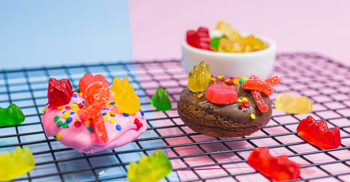 vibrant donuts and gummy bears on a wire rack against a pastel background 1