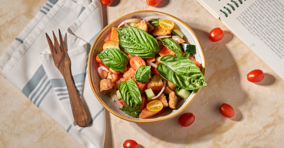 vibrant panzanella salad with fresh basil and tomatoes on a stylish table setting