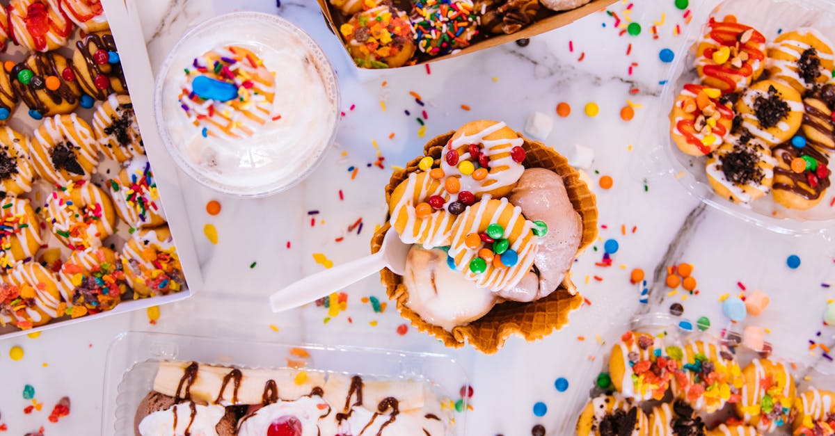 vibrant selection of ice cream and candy treats on a marble background