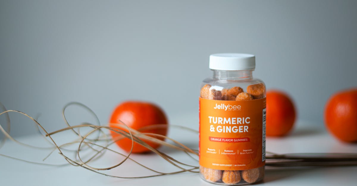vibrant still life of turmeric and ginger gummies with fresh oranges