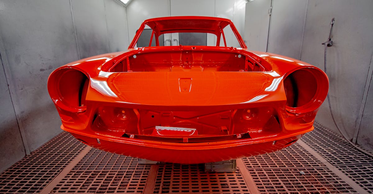 Home vividly painted car body in a professional industrial spray paint booth