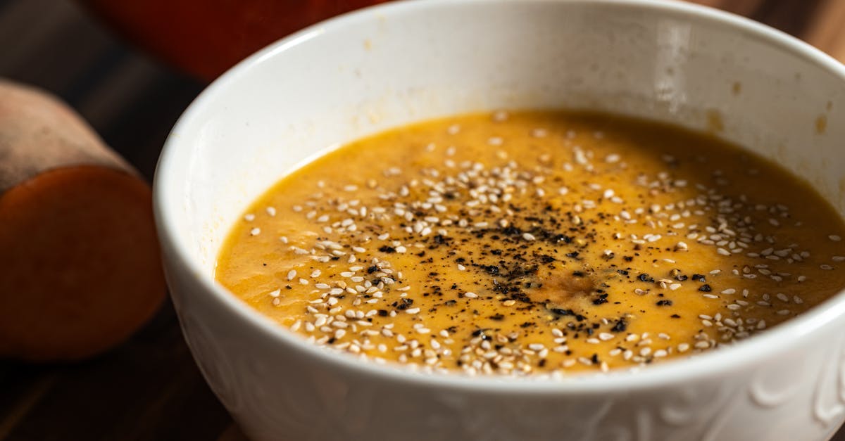 warm pumpkin soup garnished with sesame seeds and pepper perfect for a cozy meal 1