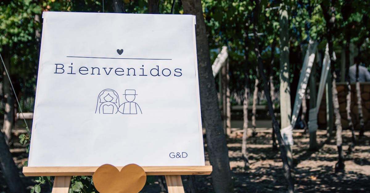 welcome sign for outdoor wedding with trees and heart decor