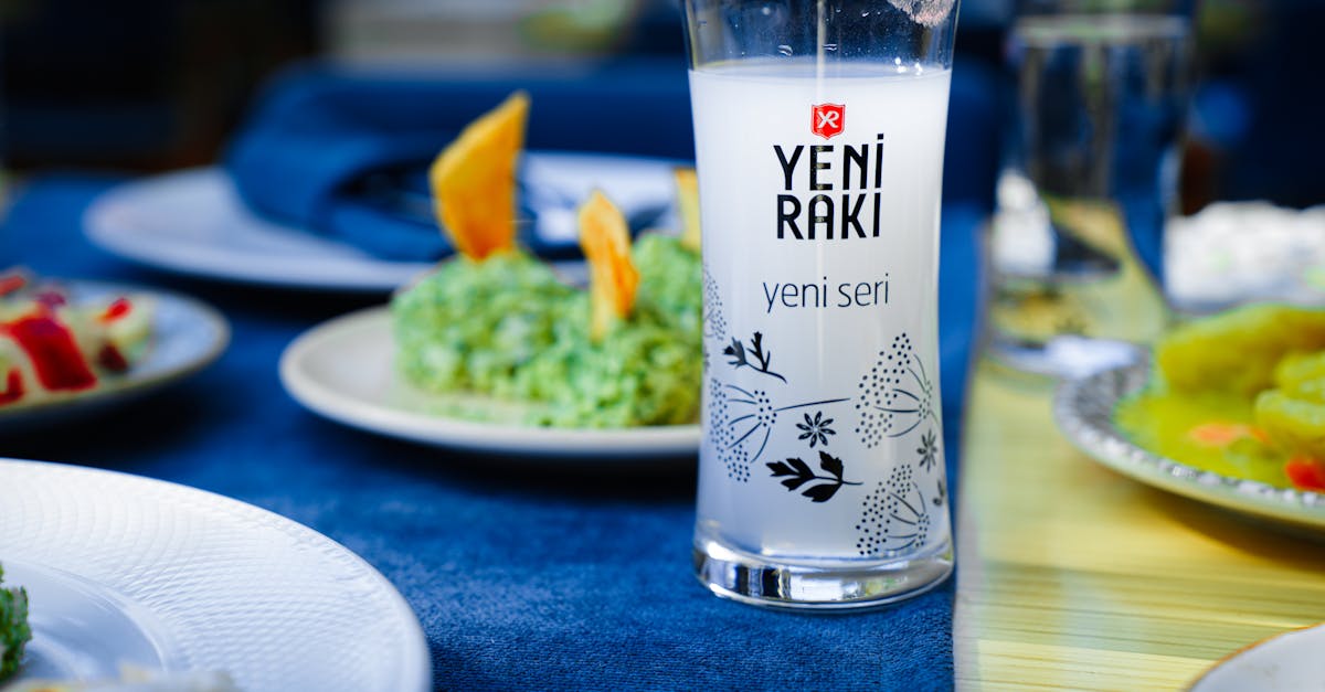 yeni raki glass on a vibrant turkish dining table setting with assorted dishes